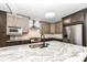 Modern kitchen with stainless steel appliances and an island at 6015 S State Road 75, Coatesville, IN 46121
