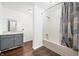 Clean bathroom with tub, shower, and grey vanity at 2666 Lafayette Ave, Columbus, IN 47201