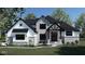 Stunning two-story home with stone accents and a welcoming front porch at 8030 Totton Ct, Zionsville, IN 46077