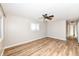 Spacious bedroom with light neutral walls and wood-look flooring at 8113 E 34Th St, Indianapolis, IN 46226