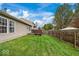 Backyard with grassy area and wooden fence at 10270 Tournon Dr, Fishers, IN 46037