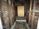 Empty bathroom with exposed walls and plumbing, ready for renovation at 1210 N Rural St, Indianapolis, IN 46201