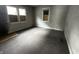 Empty bedroom with damaged walls and floors, ready for renovation at 1210 N Rural St, Indianapolis, IN 46201
