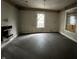 Empty bedroom with damaged walls and exposed floors, ready for renovation at 1210 N Rural St, Indianapolis, IN 46201
