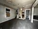 Empty living room with exposed walls and floors, ready for renovation at 1210 N Rural St, Indianapolis, IN 46201