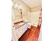 Bathroom with shower/tub combo, vanity, and wood-look flooring at 1632 Wellesley Ct # 6, Indianapolis, IN 46219