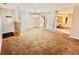 Open dining area with carpet and kitchen view at 1632 Wellesley Ct # 6, Indianapolis, IN 46219
