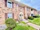 Brick building exterior with landscaping and walkway at 1632 Wellesley Ct # 6, Indianapolis, IN 46219
