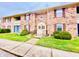 Brick building exterior with landscaping and walkway at 1632 Wellesley Ct # 6, Indianapolis, IN 46219