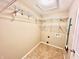 Well-equipped laundry room with shelving and space for washer and dryer at 1632 Wellesley Ct # 6, Indianapolis, IN 46219