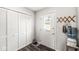 Small laundry room with white closet doors and a water dispenser at 220 W Lincoln W St, Danville, IN 46122