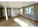 Bright living room with hardwood floors and access to the front door at 2417 Crystal St, Anderson, IN 46012