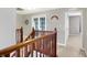 Upper hallway with wooden railing and access to bedrooms at 8701 N Deer Crossing Blvd, McCordsville, IN 46055