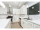 Modern kitchen with white cabinets, quartz countertops and stainless steel appliances at 1213 Cottage Ave, Indianapolis, IN 46203