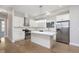 Modern kitchen with white cabinets, stainless steel appliances and an island at 1213 Cottage Ave, Indianapolis, IN 46203