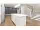 White kitchen island with quartz countertop, offering extra prep space at 1213 Cottage Ave, Indianapolis, IN 46203