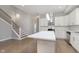 Modern kitchen with white cabinets, quartz countertops, and stainless steel appliances at 1213 Cottage Ave, Indianapolis, IN 46203