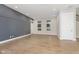 Spacious living room with hardwood floors and gray accent wall at 1213 Cottage Ave, Indianapolis, IN 46203