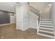 Modern staircase with metal railing and hardwood floors at 1213 Cottage Ave, Indianapolis, IN 46203