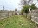 Backyard with wooden fence and grassy area at 1310 N Oakland Ave, Indianapolis, IN 46201