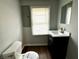 Small bathroom with sink, toilet, and mirror at 1310 N Oakland Ave, Indianapolis, IN 46201