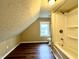 Full bathroom with shower/tub combo and wood-look flooring at 1310 N Oakland Ave, Indianapolis, IN 46201