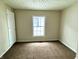 Spacious bedroom with neutral walls and carpet flooring at 1310 N Oakland Ave, Indianapolis, IN 46201