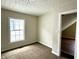 Cozy bedroom with carpet and access to bathroom at 1310 N Oakland Ave, Indianapolis, IN 46201