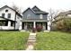 Gray duplex with white trim, front porches, and landscaping at 1310 N Oakland Ave, Indianapolis, IN 46201