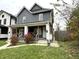 Gray duplex with white trim, front porches, and landscaping at 1310 N Oakland Ave, Indianapolis, IN 46201