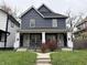 Stunning two-unit building, featuring a modern gray exterior and a well-maintained lawn at 1310 N Oakland Ave, Indianapolis, IN 46201