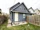 Rear exterior view, showing gray siding and wooden fence at 1310 N Oakland Ave, Indianapolis, IN 46201