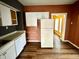 Kitchen with white cabinets, refrigerator, and dishwasher at 1310 N Oakland Ave, Indianapolis, IN 46201