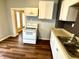 Kitchen with white appliances and double sink at 1310 N Oakland Ave, Indianapolis, IN 46201