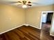Living room with hardwood floors and ceiling fan at 1310 N Oakland Ave, Indianapolis, IN 46201