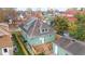 House with a backyard, detached garage, and wooden deck at 1542 S Alabama St, Indianapolis, IN 46225