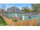 Aerial view of house, detached garage, and fenced backyard at 1542 S Alabama St, Indianapolis, IN 46225