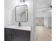 Modern bathroom with white subway tiles, black fixtures and a white bathtub at 1542 S Alabama St, Indianapolis, IN 46225