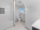 Clean bathroom with white subway tiles and a modern bathtub at 1542 S Alabama St, Indianapolis, IN 46225