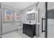 Modern bathroom with sleek vanity, frameless shower, and marble floors at 1542 S Alabama St, Indianapolis, IN 46225