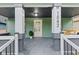 Charming front porch with a swing and a newly painted door at 1542 S Alabama St, Indianapolis, IN 46225