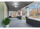Spacious front porch featuring a swing, providing a relaxing outdoor area at 1542 S Alabama St, Indianapolis, IN 46225