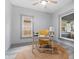 Bright home office featuring a yellow chair and large windows at 1542 S Alabama St, Indianapolis, IN 46225