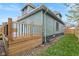 Side view of green house with wooden deck and backyard at 1542 S Alabama St, Indianapolis, IN 46225