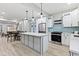 Modern kitchen with white cabinets, quartz countertops and stainless steel appliances at 1542 S Alabama St, Indianapolis, IN 46225
