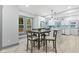Modern kitchen with white cabinets, a large island, and light blue backsplash at 1542 S Alabama St, Indianapolis, IN 46225