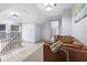 Bright landing area featuring a leather sofa and natural light at 1542 S Alabama St, Indianapolis, IN 46225