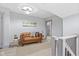 Light-filled landing with leather couch, providing a relaxing space at 1542 S Alabama St, Indianapolis, IN 46225