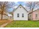 Charming white house with a well-maintained lawn at 1911 Wilcox St, Indianapolis, IN 46222