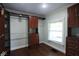 Large walk-in closet with custom built-ins and hardwood floors at 3122 N Pennsylvania St, Indianapolis, IN 46205